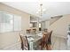 Dining room with a chandelier and seating for six guests at 845 Bladensburg St, Las Vegas, NV 89110