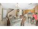 A dining room with a dining table for eight, chandelier, and tiled floor at 845 Bladensburg St, Las Vegas, NV 89110