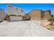 Home exterior showcasing a spacious driveway, two-car garage, and porte-cochere at 845 Bladensburg St, Las Vegas, NV 89110