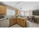 Kitchen with appliances and view into dining area at 845 Bladensburg St, Las Vegas, NV 89110