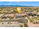 Beautiful aerial view of a two-story home in a cul-de-sac of a Nevada neighborhood with mountain views at 8925 Kenzie Cove St, Las Vegas, NV 89131