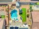 Stunning aerial view of a backyard oasis featuring a pool, spa, gazebo, lush lawn, and meticulously landscaped surroundings at 8925 Kenzie Cove St, Las Vegas, NV 89131
