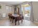 Dining area with a view of the backyard pool and sliding glass doors for easy outdoor access at 8925 Kenzie Cove St, Las Vegas, NV 89131