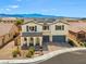 Inviting two-story home showcasing a beautiful desert landscape and mountain views in the background at 8925 Kenzie Cove St, Las Vegas, NV 89131