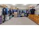 Large walk-in closet with shelving, hanging racks, and dresser drawers for maximum storage at 8925 Kenzie Cove St, Las Vegas, NV 89131