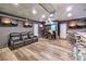Finished basement featuring a sound recording booth, bar and media chairs at 8932 Beach Front Dr, Las Vegas, NV 89117