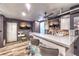 Finished basement bar with TV, bar seating, and small kitchenette at 8932 Beach Front Dr, Las Vegas, NV 89117