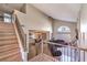 Open concept foyer featuring wood flooring, staircase, and views of the dining and living areas at 8932 Beach Front Dr, Las Vegas, NV 89117