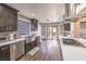 Bright kitchen featuring stainless steel appliances, quartz countertops, and sliding door to the backyard at 8932 Beach Front Dr, Las Vegas, NV 89117