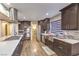Modern kitchen with stainless steel appliances, wood floors, and large pantry at 8932 Beach Front Dr, Las Vegas, NV 89117