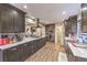 Spacious kitchen with modern appliances, a large island, quartz countertops, and ample cabinet space at 8932 Beach Front Dr, Las Vegas, NV 89117