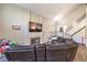 Open-concept living room with fireplace, high ceilings, and staircase at 8932 Beach Front Dr, Las Vegas, NV 89117