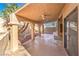 Covered patio with tiled floor and stucco columns at 8932 Beach Front Dr, Las Vegas, NV 89117