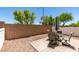 Secluded backyard featuring desert landscaping, patio seating, and privacy walls at 9362 Straw Hays St # 103, Las Vegas, NV 89178