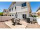 Backyard featuring desert landscaping, patio seating, and exterior elevation at 9362 Straw Hays St # 103, Las Vegas, NV 89178