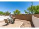 Secluded backyard with desert landscaping, patio seating, and privacy walls at 9362 Straw Hays St # 103, Las Vegas, NV 89178