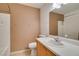 Bright bathroom with ceramic tile, white countertop, and a shower-tub combo at 9362 Straw Hays St # 103, Las Vegas, NV 89178