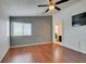 Comfortable bedroom features laminate floors, ceiling fan and ample natural light at 9362 Straw Hays St # 103, Las Vegas, NV 89178