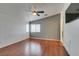 Spacious bedroom with laminate floors, ceiling fan, and ample natural light at 9362 Straw Hays St # 103, Las Vegas, NV 89178