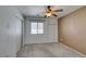 Neutral bedroom features a window for natural light, closet, and modern fan at 9362 Straw Hays St # 103, Las Vegas, NV 89178