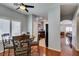 Dining area near the kitchen features bright natural light and a modern fan at 9362 Straw Hays St # 103, Las Vegas, NV 89178