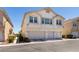 Two-story condo with three-car garage with manicured front yard at 9362 Straw Hays St # 103, Las Vegas, NV 89178