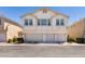 A two-story condo shows a three-car garage and front yard landscaping at 9362 Straw Hays St # 103, Las Vegas, NV 89178