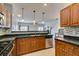 Open concept kitchen features stainless steel appliances and granite countertops at 9362 Straw Hays St # 103, Las Vegas, NV 89178