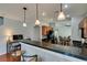 Charming kitchen featuring wood cabinets, breakfast bar, and stainless steel appliances at 9362 Straw Hays St # 103, Las Vegas, NV 89178