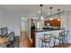 Charming kitchen featuring a breakfast bar and access to a hallway at 9362 Straw Hays St # 103, Las Vegas, NV 89178
