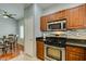 Well-lit kitchen features stainless steel appliances, gas range and granite counters at 9362 Straw Hays St # 103, Las Vegas, NV 89178