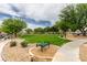 Lush green park offers residents a serene escape with walking paths, benches and open space at 9362 Straw Hays St # 103, Las Vegas, NV 89178