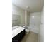 Clean bathroom with a tub, shower, vanity, and tiled floors at 9402 Crimson Sky St, Las Vegas, NV 89178