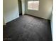 Bedroom featuring neutral walls, carpeted flooring, and a sunny window at 9402 Crimson Sky St, Las Vegas, NV 89178