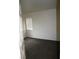 Bedroom featuring light walls, carpeted flooring, and a window with blinds at 9402 Crimson Sky St, Las Vegas, NV 89178