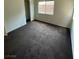 Bedroom featuring neutral walls, carpeted flooring, and a sunny window at 9402 Crimson Sky St, Las Vegas, NV 89178