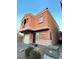 Two-story home with a garage, a balcony, and low maintenance desert landscaping at 9402 Crimson Sky St, Las Vegas, NV 89178