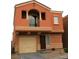 Two-story home features a two-car garage, a front balcony, and desert landscaping at 9402 Crimson Sky St, Las Vegas, NV 89178