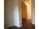 A hallway view with plain walls and brown flooring at 9402 Crimson Sky St, Las Vegas, NV 89178
