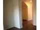 A hallway view with plain walls and brown flooring at 9402 Crimson Sky St, Las Vegas, NV 89178