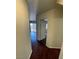 Hallway featuring hard surface flooring and access to the backyard sliding door at 9402 Crimson Sky St, Las Vegas, NV 89178