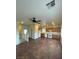 Open-concept living space with tile flooring and adjacent kitchen at 9402 Crimson Sky St, Las Vegas, NV 89178