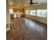 Bright kitchen with a ceiling fan, tile flooring, and wooden cabinets at 9402 Crimson Sky St, Las Vegas, NV 89178