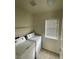 Bright laundry room featuring a standard washer and dryer and a window at 9402 Crimson Sky St, Las Vegas, NV 89178