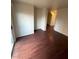 Bright living room with hardwood floors and neutral walls, creating a versatile space at 9402 Crimson Sky St, Las Vegas, NV 89178