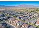 Scenic aerial view of the neighborhood against a mountain backdrop at 9476 Lunar Phase St, Las Vegas, NV 89143