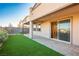 Cozy backyard featuring artificial turf, patio, and access to the home at 9476 Lunar Phase St, Las Vegas, NV 89143