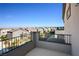 Balcony view showcasing neighborhood rooftops against a clear, blue sky at 9476 Lunar Phase St, Las Vegas, NV 89143