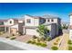 Attractive two-story home featuring a modern design, neat landscaping, a two-car garage and brick driveway at 9476 Lunar Phase St, Las Vegas, NV 89143