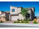 Modern two-story home with a two-car garage and desert landscaping at 9476 Lunar Phase St, Las Vegas, NV 89143